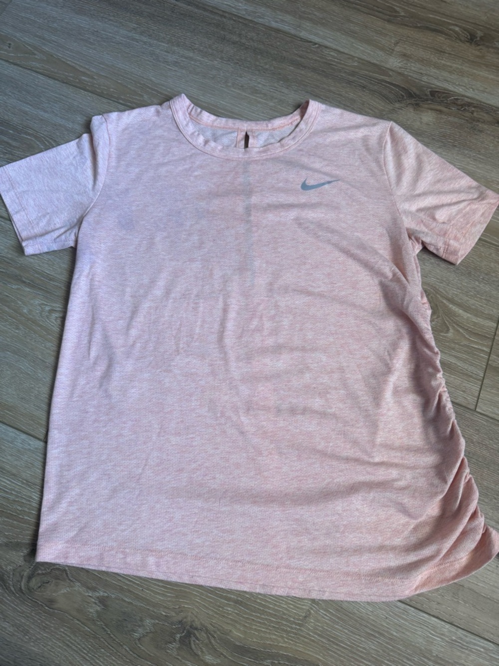 Nike Dri fit  Women’s Light Pink Short Sleeve T-shirt open back scrunch side.
